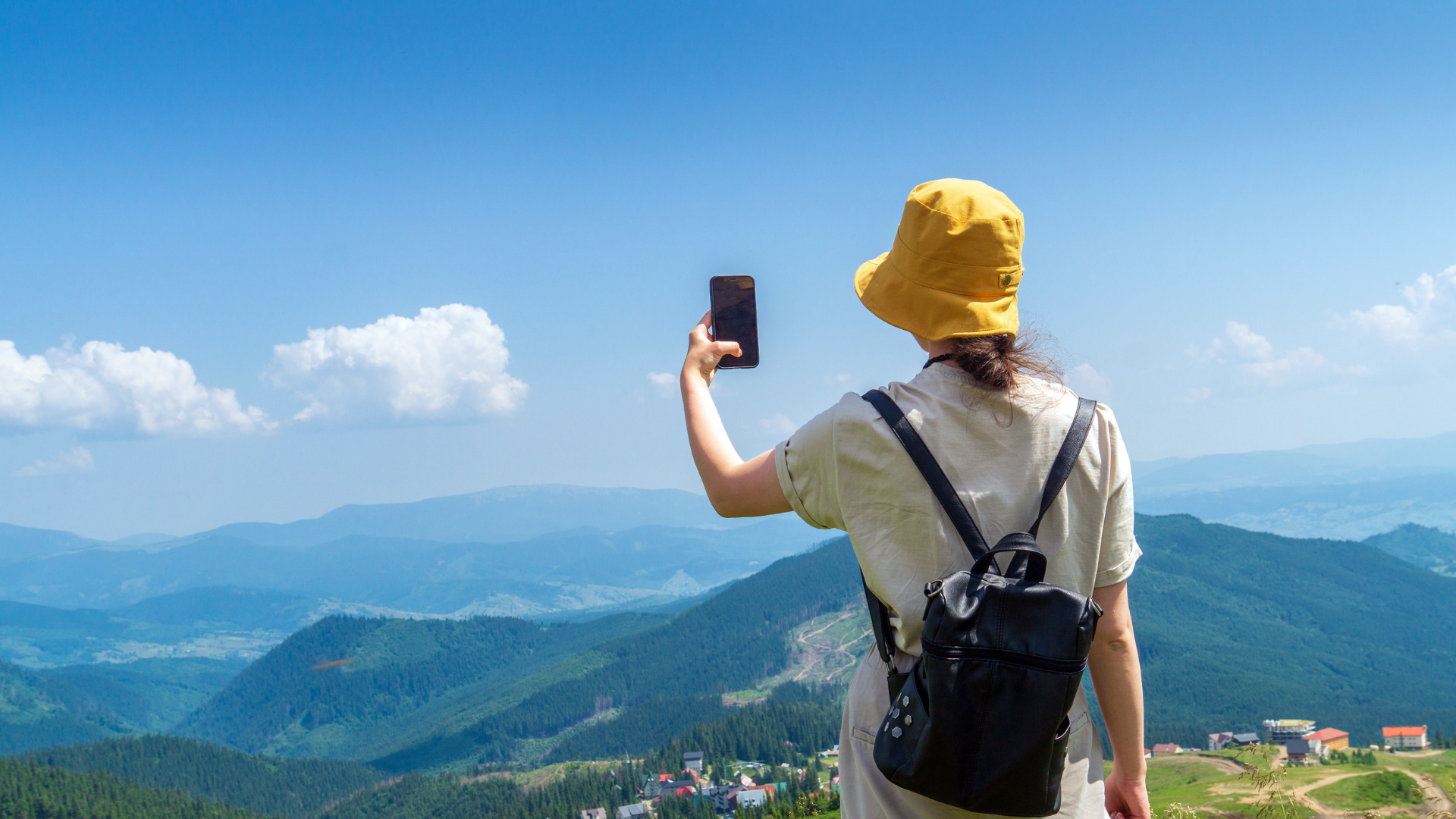 Person outdoors holding a phone to represent cross-device identity coverage